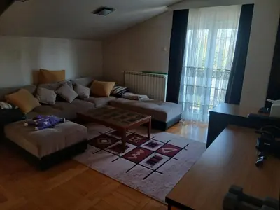 a living room with a couch and a coffee table at Villa Atlantis in Guncati