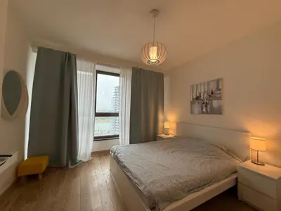 a bedroom with a bed and a large window at BW Maca - Aurora in Belgrade