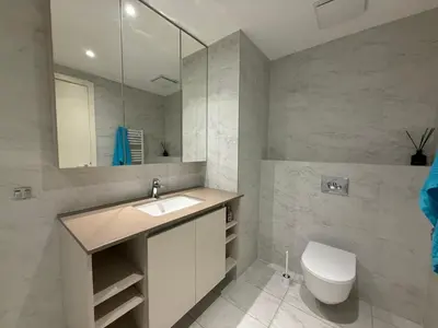 a bathroom with a sink and a toilet at BW Maca - Aurora in Belgrade