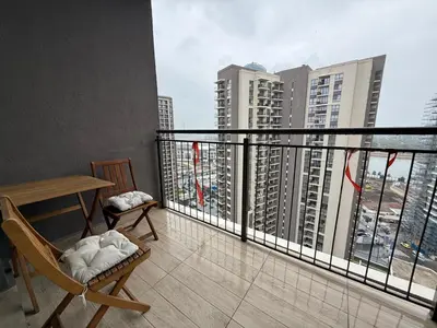 a balcony with a table and chairs on a building at BW Maca - Aurora in Belgrade