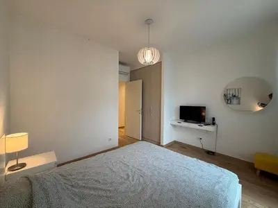 a bedroom with a bed and a television in it at BW Maca - Aurora in Belgrade