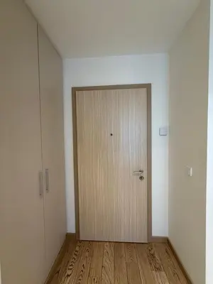 a door in an empty room with a wooden floor at BW Maca - Aurora in Belgrade