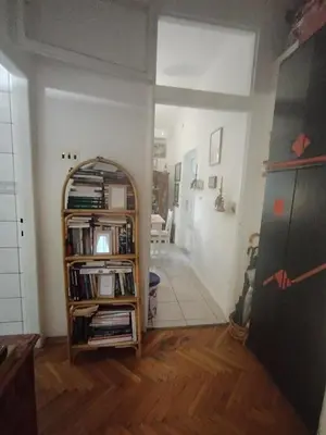 a room with a book shelf with books at Apartment Kalis in Belgrade