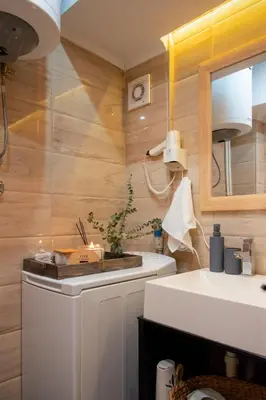 a small bathroom with a sink and a mirror at Ollio Elegant Vintage in Belgrade