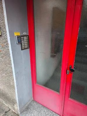 a red door with a window on a building at Cozy one in Belgrade centre in Belgrade