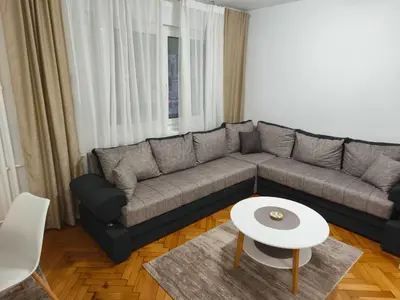 a living room with a couch and a table at Cozy one in Belgrade centre in Belgrade