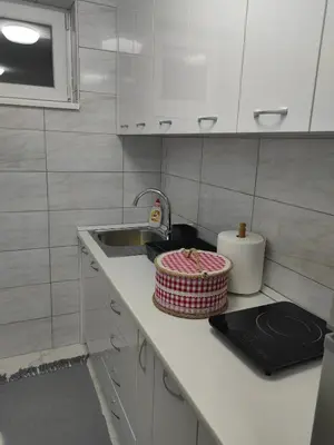 a kitchen counter top with a sink and a sink at Apartmani B&R in Lazarevac