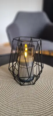 a glass coffee table with candles on top of a table at ETA Apartments in Belgrade