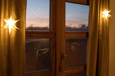 a window with two windows with stars on them at Morning Star River Retreat - A Boathouse in Belgrade in Belgrade