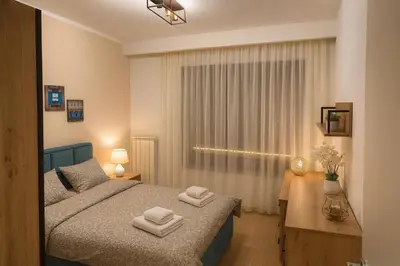 a bedroom with a bed with two towels on it at Belgrade Waterfront KINGS Park Residences in Belgrade