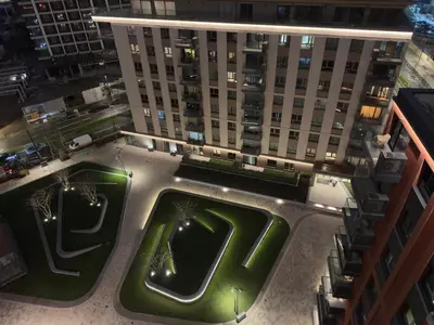 an aerial view of a building with a pool at Belgrade Waterfront KINGS Park Residences in Belgrade