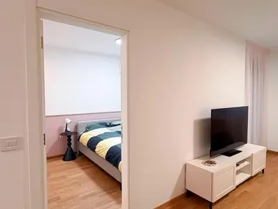 a bedroom with a bed and a mirror at Room 66
