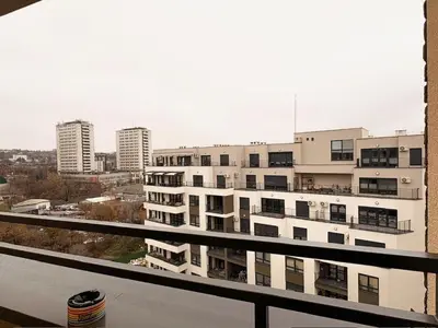 a view of a large white building from a balcony at Room 66