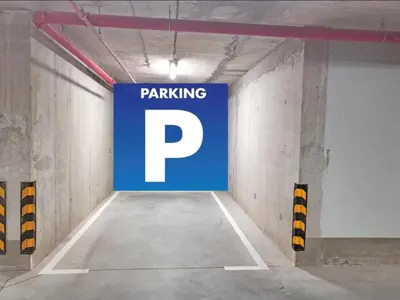 a parking garage with a parking sign on the wall at Eterna Premium Apartment 1 Bedroom in Sajmište