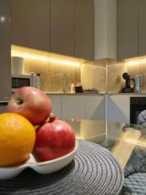a bowl of fruit on a table in a kitchen at Belgrade Waterfront-BW Hena in Belgrade