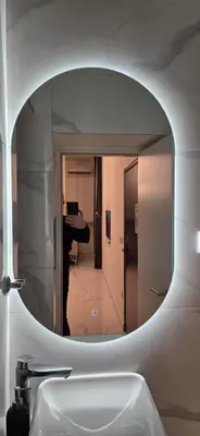 a mirror above a sink in a bathroom at White Queen in Bukorovac