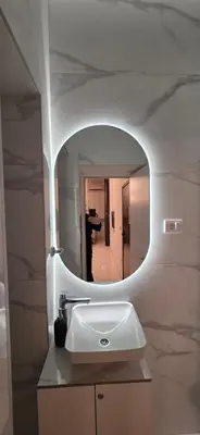 a bathroom with a sink and a mirror at White Queen in Bukorovac