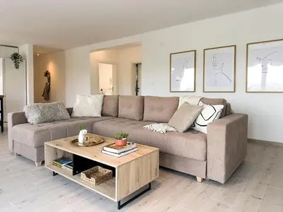 a living room with a couch and a coffee table at Mali Raj in Mala Ivanča