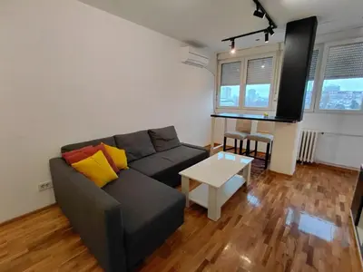 a living room with a couch and a table at Fontana in Belgrade