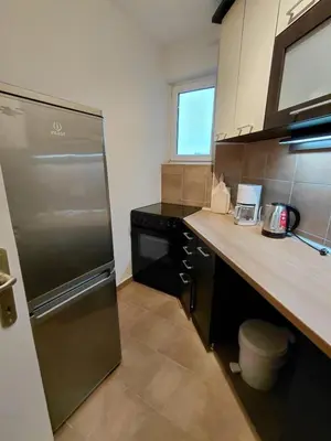 a kitchen with a stainless steel refrigerator and a counter at Fontana in Belgrade