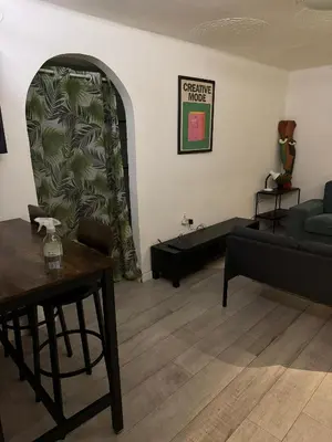 a living room with a couch and a table at BelgradeCenterVibe in Belgrade