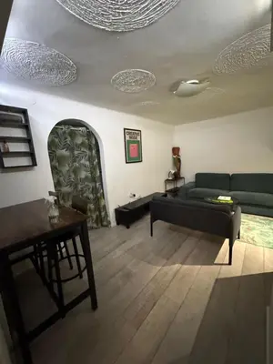 a living room with a couch and a table at BelgradeCityVibe in Belgrade