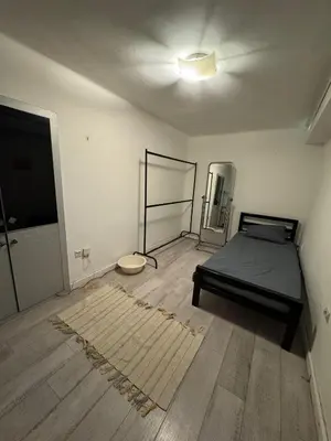 an empty room with a bed and a floor at BelgradeCityVibe in Belgrade
