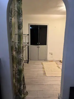 a room with a hallway with a door and a room with a door at BelgradeCityVibe in Belgrade