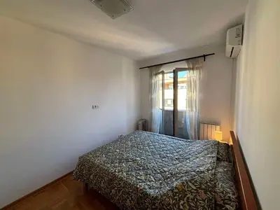 a bedroom with a bed and a window at Botanical Garden in Belgrade