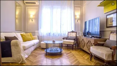 a living room with a couch and a tv at Apartment JADE Vracar, Belgrade in Belgrade