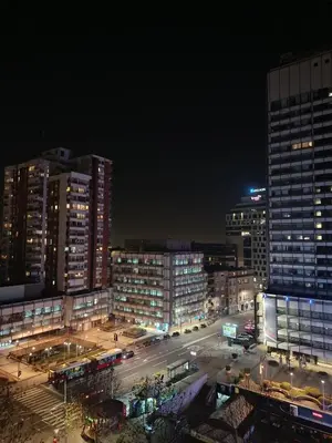 a city skyline at night with tall buildings at Urban Garden Apartments - Sunflower 2 in Belgrade