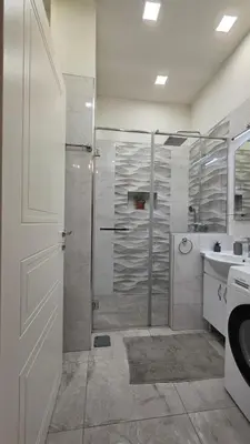 a bathroom with a shower and a sink at Vracar Luxury Apartment in Belgrade