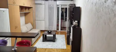 a living room with a couch and a table at Vena in Belgrade