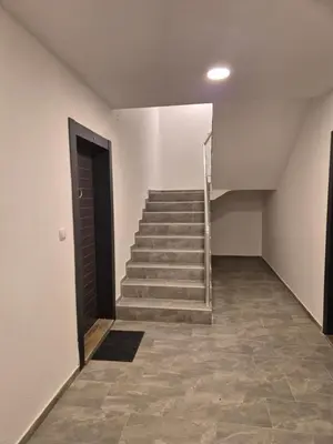 an empty hallway with stairs and a door at Teja- new apartment for 4 person with free parking space in Belgrade