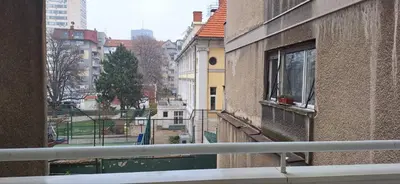 an apartment balcony with a view of a city at Retiro Apartman in Belgrade