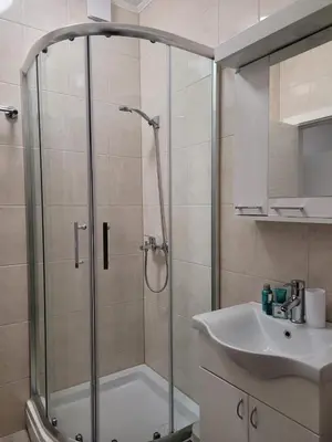 a bathroom with a shower and a sink at Beosan in Belgrade