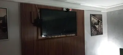 a flat screen tv on a wall in a room at Apartment Cabin-Style in Belgrade