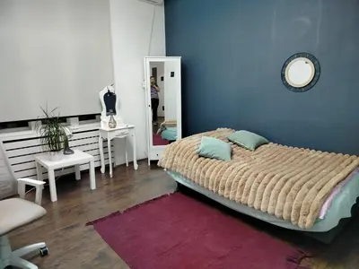 a bedroom with a large bed and a mirror at Moulin ROSE in Belgrade