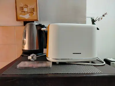 a white toaster sitting on top of a counter at Moulin ROSE in Belgrade