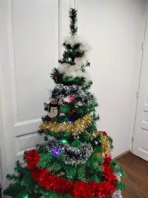 a christmas tree with decorations on it in a room at Moulin ROSE in Belgrade