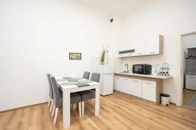 a kitchen and dining room with a table and chairs at Apartment Moonstone 4 in Belgrade