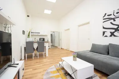 a living room with a couch and a table at Apartment Moonstone 4 in Belgrade