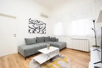 a living room with a couch and a table at Apartment Moonstone 4 in Belgrade