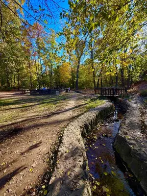 a dirt road next to a river in a park at Belgrade Forest Gate near center in Belgrade