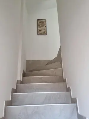 a set of stairs with a sign on the wall at Infinity in Belgrade