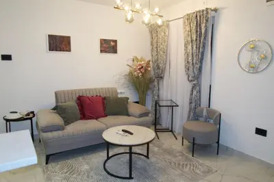 a living room with a couch and a table at Infinity in Belgrade