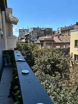 a blue bench sitting on the side of a building at Kneginje Ljubice apartment in Belgrade