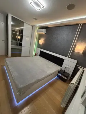 a bedroom with a large bed in a room at Vist Sava Center Residence in Belgrade