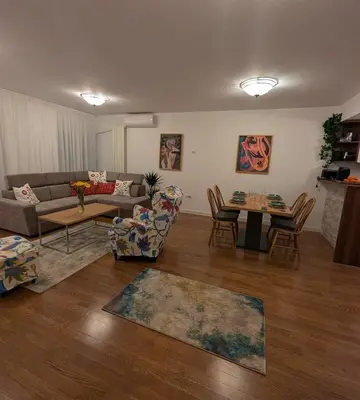 a living room with a couch and a table at Nova Vracar - Luxury Apartment & Private Parking in Belgrade