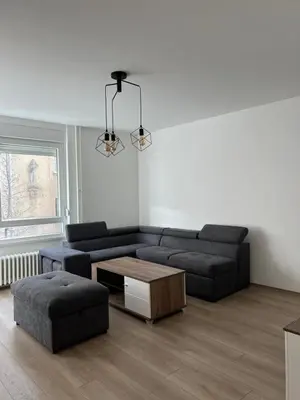 a living room with a couch and a coffee table at Tesla Lux Apartman in Belgrade